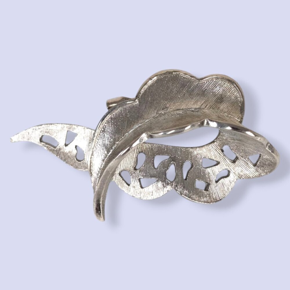 V. Silver Tone Textured Swoop Cut Out Brooch